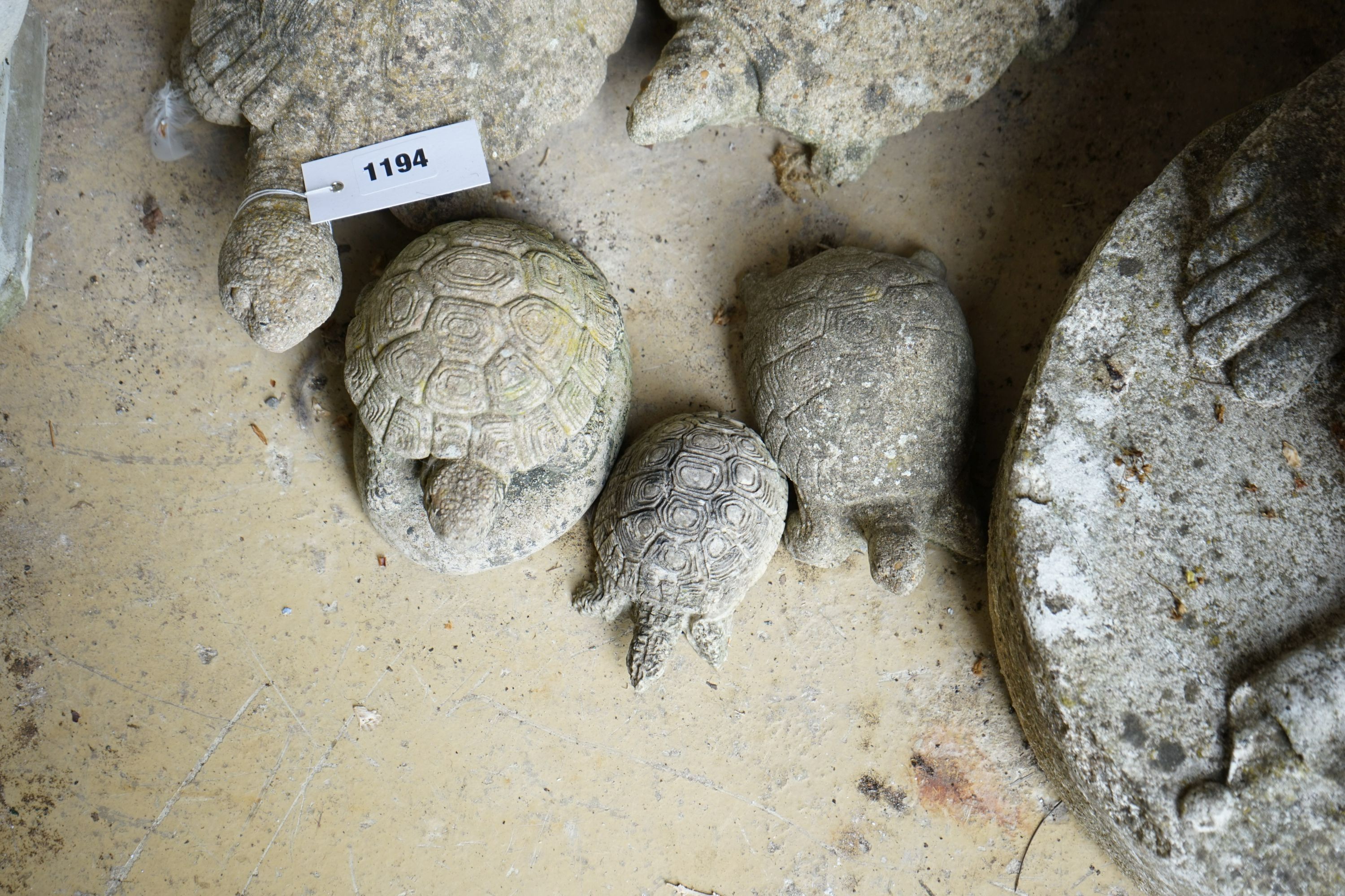 Five reconstituted stone tortoise garden ornaments, largest length 28cm